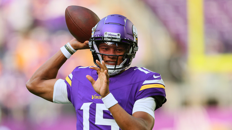 Josh Dobbs throwing a football