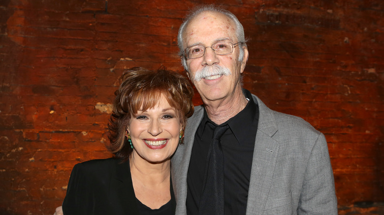 Joy Behar and husband Steve Janowitz smiling standing together