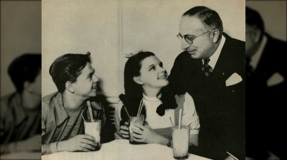 Judy Garland, Mickey Rooney, and Louis B. Mayer publicity still