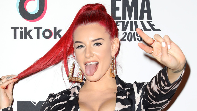 Justina Valentine giving a peace sign