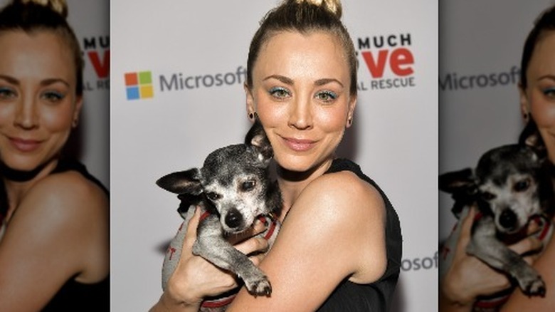 Kaley Cuoco holding a dog