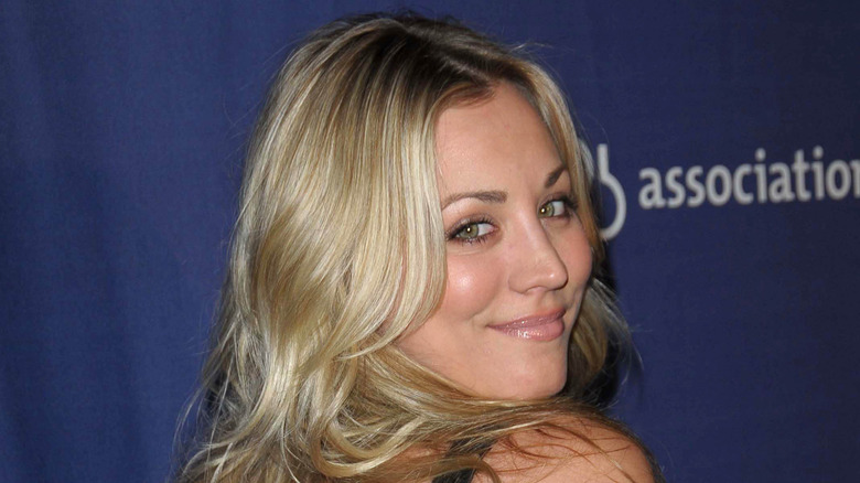 Kaley Cuoco looking over her shoulder