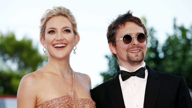 Actress Kate Hudson and singer Matt Bellamy, posing