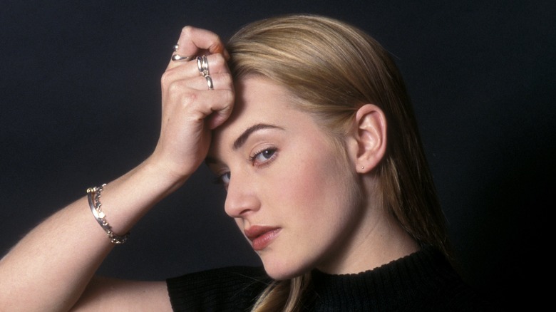 Young Kate Winslet posing for camera