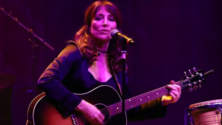 Katey Sagal sings and strums guitar