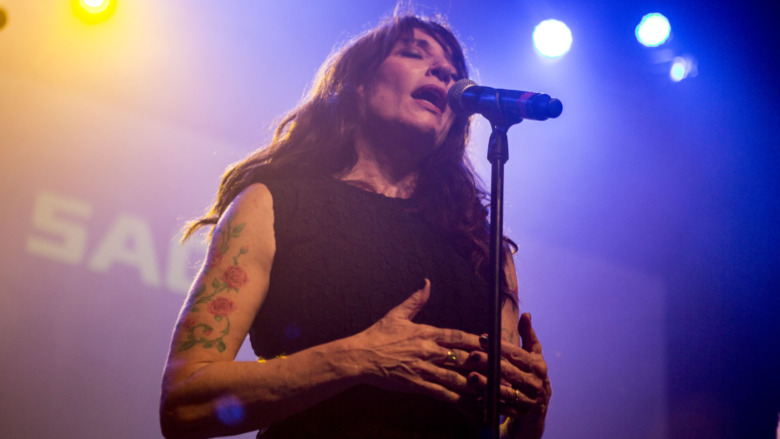 Katey Sagal soulfully sings into microphone