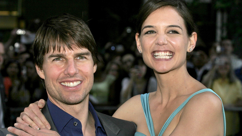 Katie Holmes and Tom Cruise, both smiling