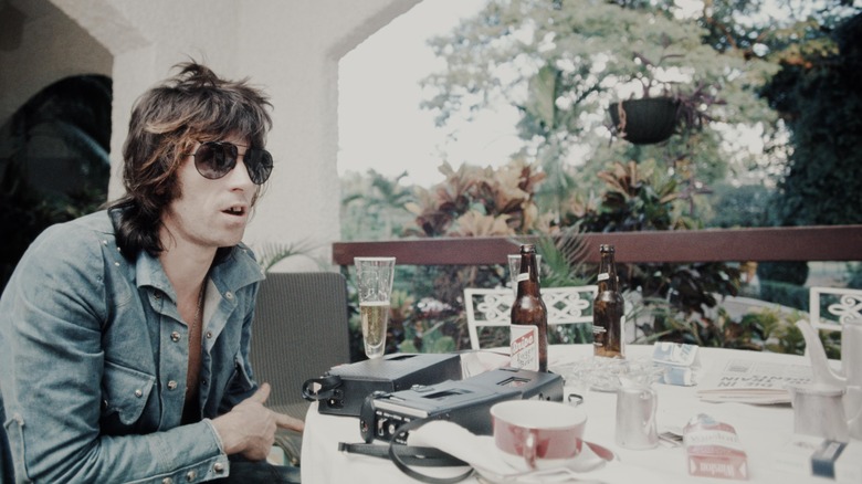 Keith Richards seated at a table