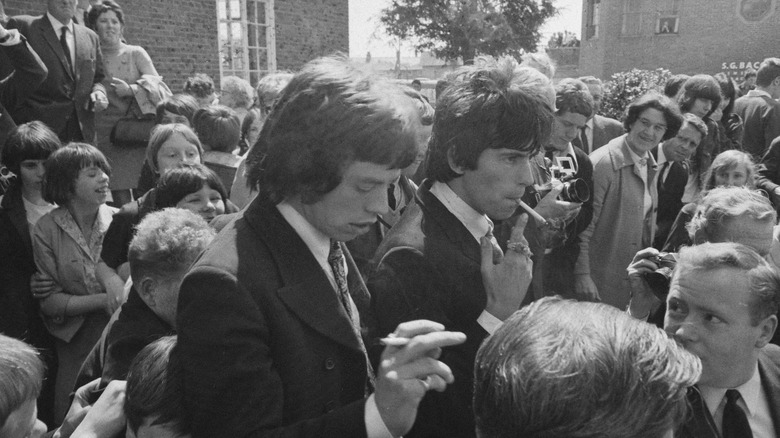Mick Jagger and Keith Richards walking out of courthouse 