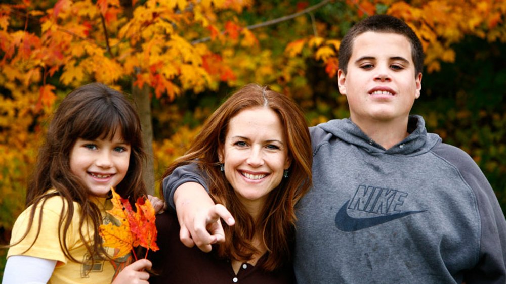 Kelly Preston (C) and their children Jett (R) and Ella pose in this undated picture.