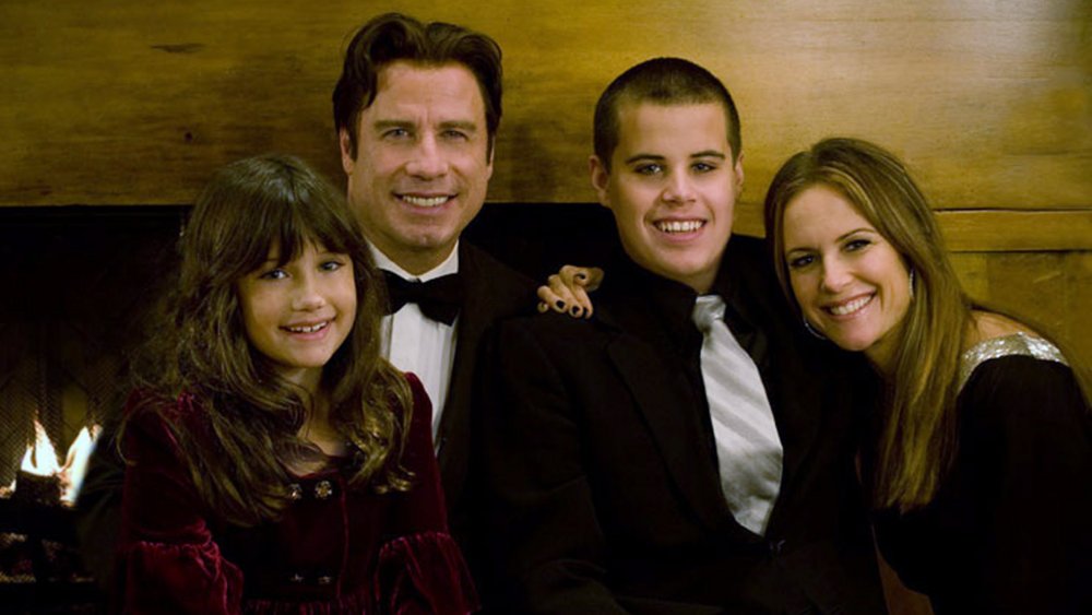 John Travolta (2nd L), his wife Kelly Preston (R) and their children Jett (2nd R) and Ella pose in this undated picture.
