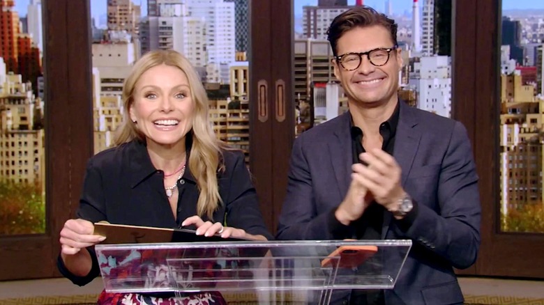 Kelly Ripa smiling on-air with Ryan Seacrest