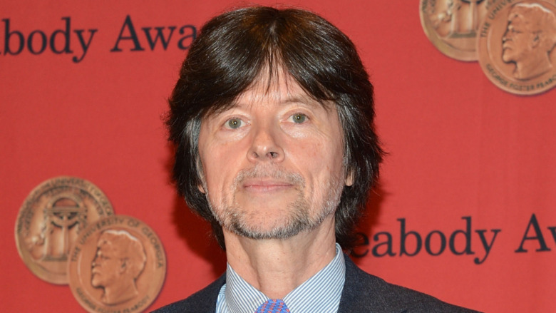 Ken Burns holding an award