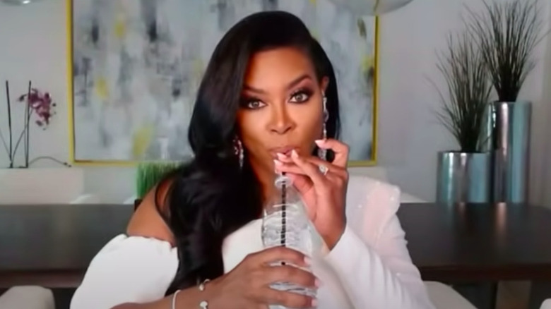 Kenya Moore on RHOA, sipping a drink from straw