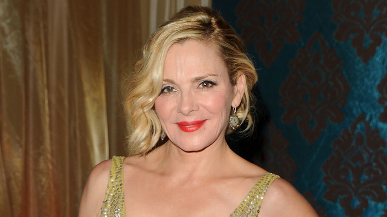 Kim Cattrall smiling red lips