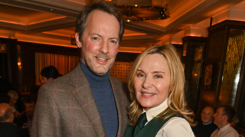 Kim Cattrall poses with Russell Thomas