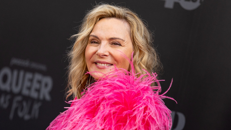 Kim Cattrall smiling pink feathers