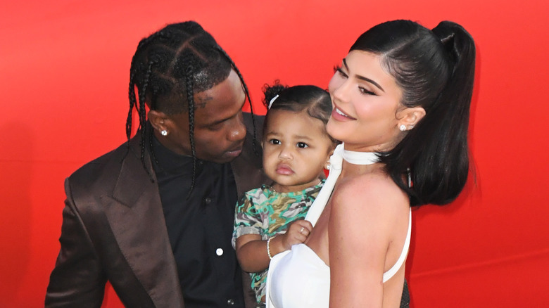 Travis Scott, Stormi Webster, Kylie Jenner laughing