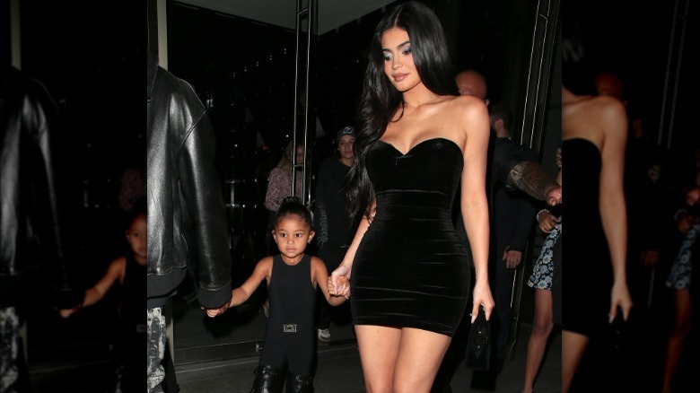 Stormi Webster and Kylie Jenner hold hands