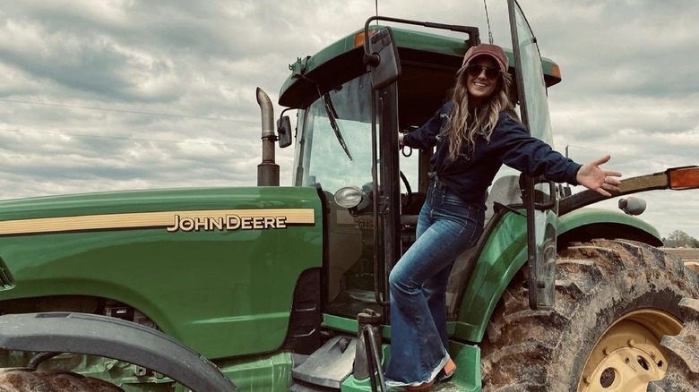 Lainey Wilson on a tractor