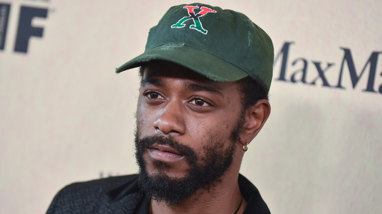 LaKeith Stanfield wearing a baseball hat