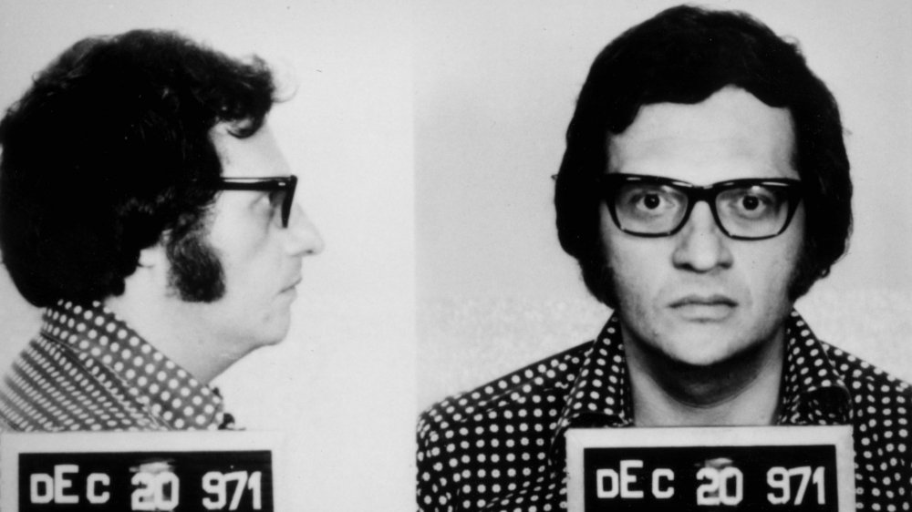 Larry King stands for mugshot in 1971