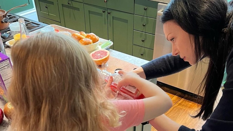 Laura Prepon, daughter in kitchen