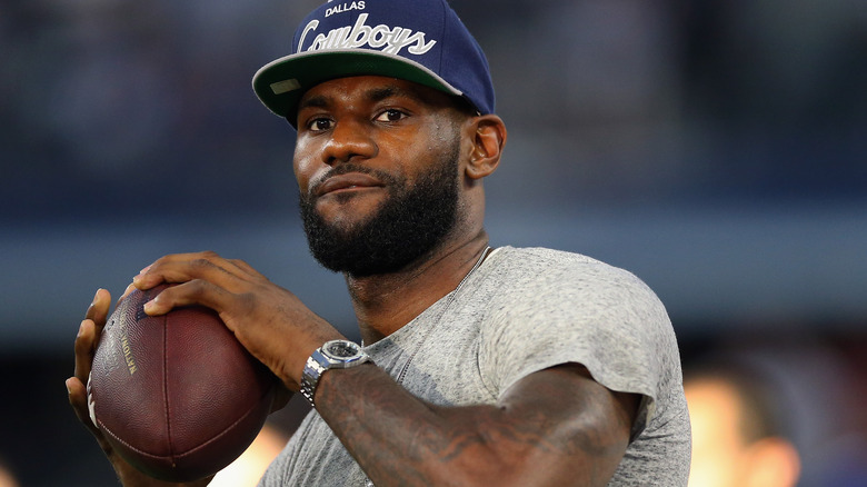 LeBron James throwing a football