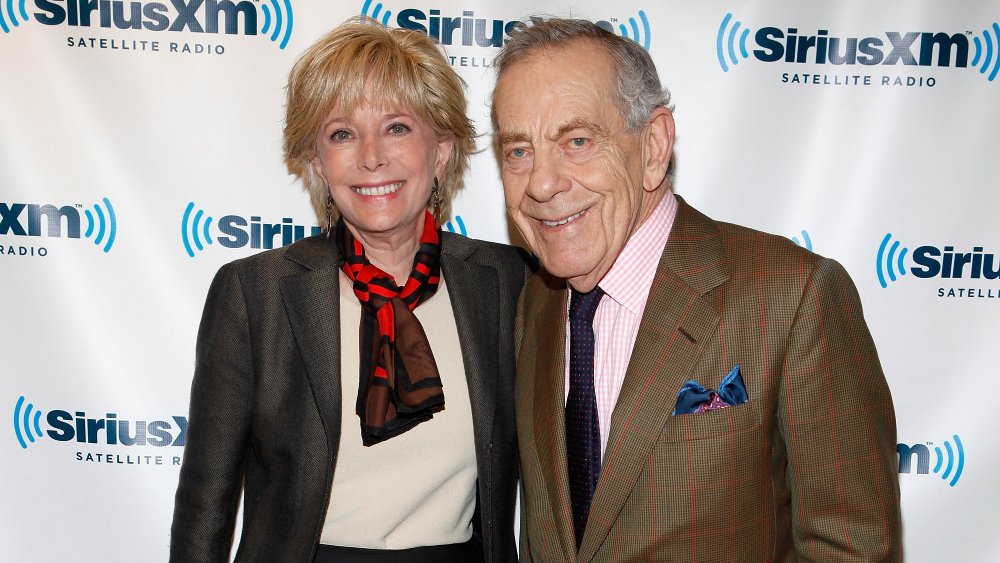 Lesley Stahl and Mike Wallace in front of SiriusXM promo wall