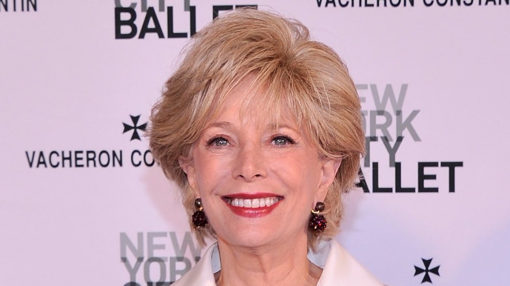 Lesley Stahl in front of pink promo wall