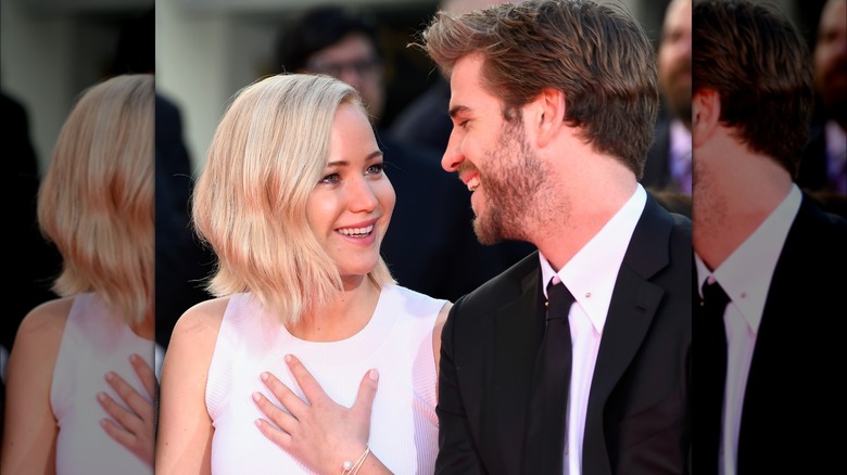 Jennifer Lawrence and Liam Hemsworth laughing