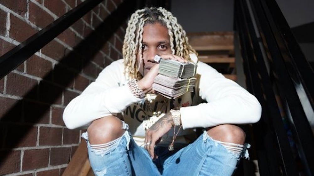 Lil Durk holding money stack