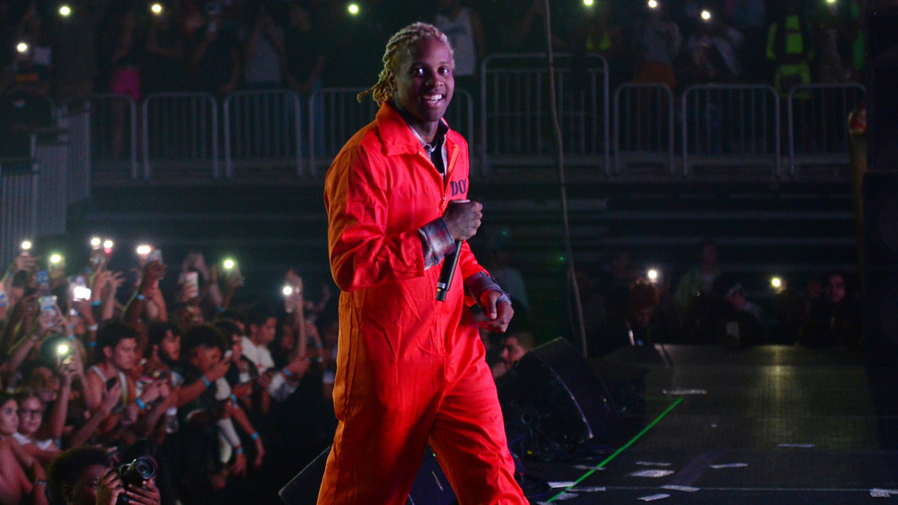 Lil Durk on stage, smiling