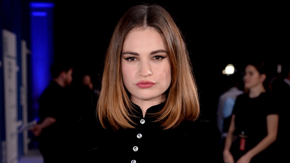 Lily James posing with a serious expression