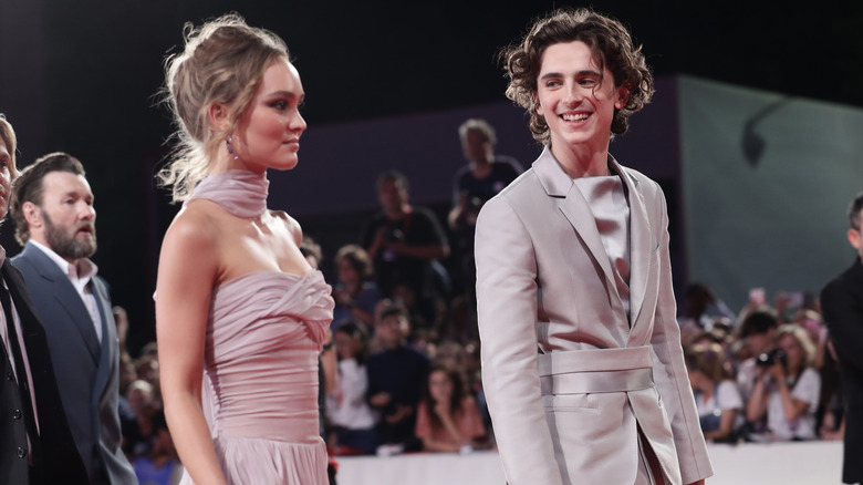 Lily-Rose Depp and Timothee Chalamet, walking