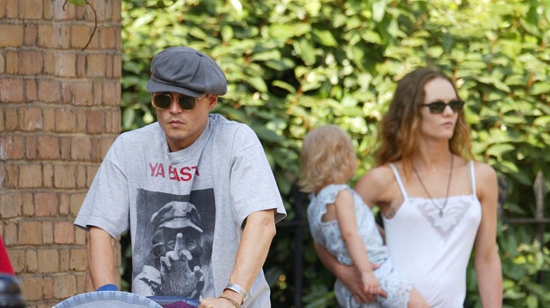 Johnny Depp, Vanessa Paradis, holding daughter