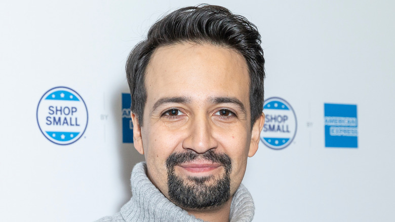 Lin-Manuel Miranda in a gray sweater