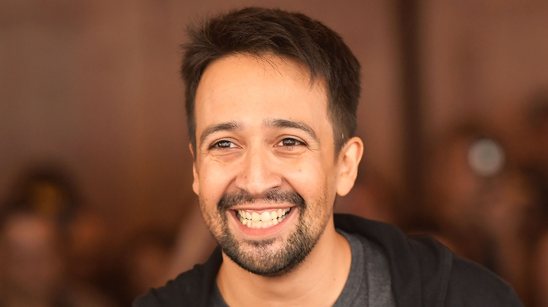 Lin-Manuel Miranda holding a mic