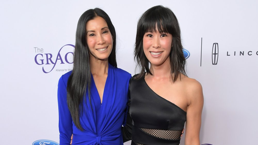 Lisa Ling and Laura Ling posing on red carpet