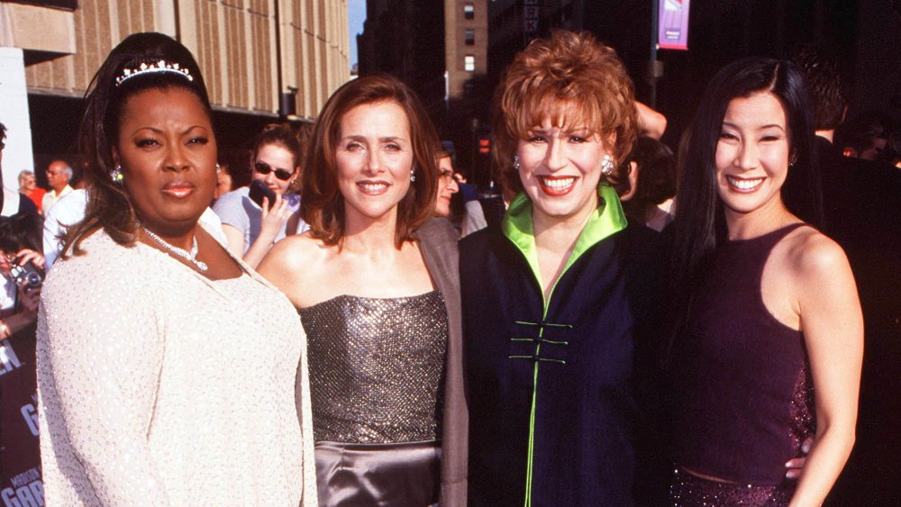 Star Jones, Meredith Vieira, Joy Behar, and Lisa Ling posing on the red carpet