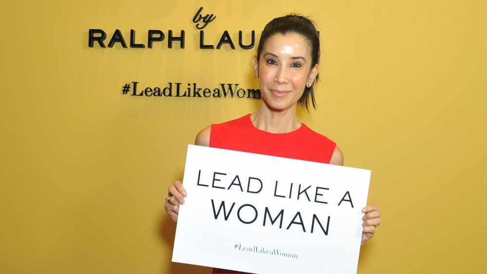 Lisa Ling holding a "Lead Like A Woman" sign