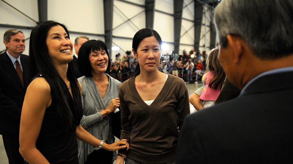 Lisa Ling, Mary Ling, Laura Ling, Doug Ling laughing at an event