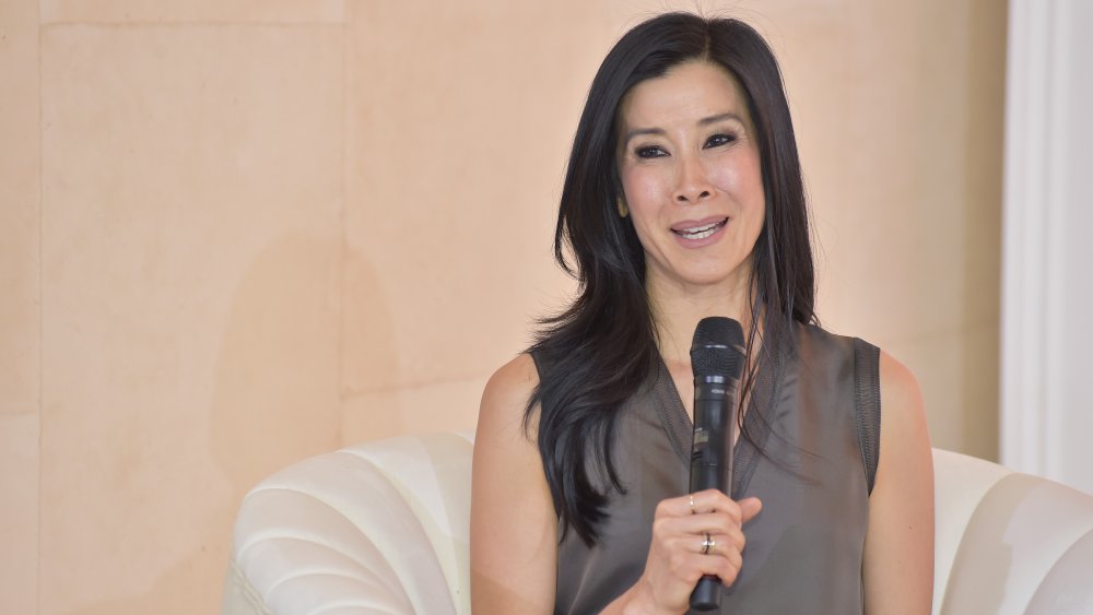 Lisa Ling speaking into a microphone