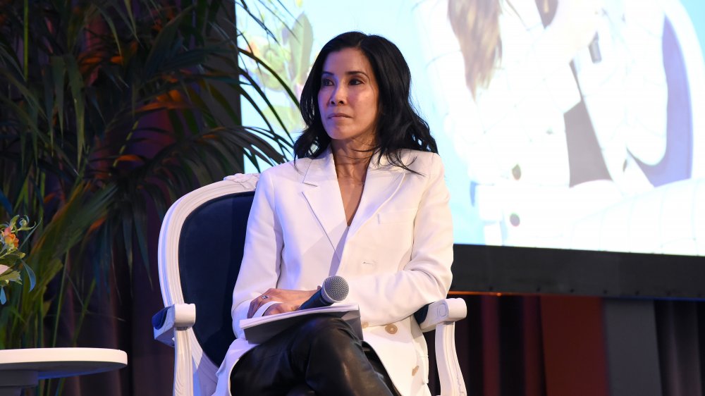 Lisa Ling at a panel, listening