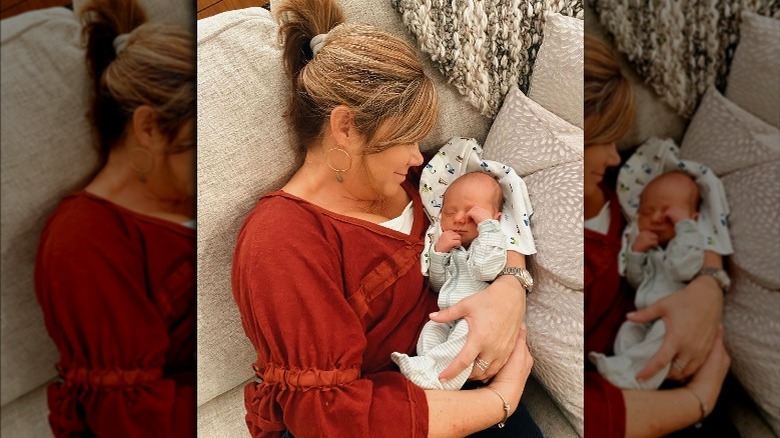 Caryn holding her grandson