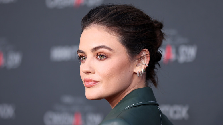 Lucy Hale posing on red carpet