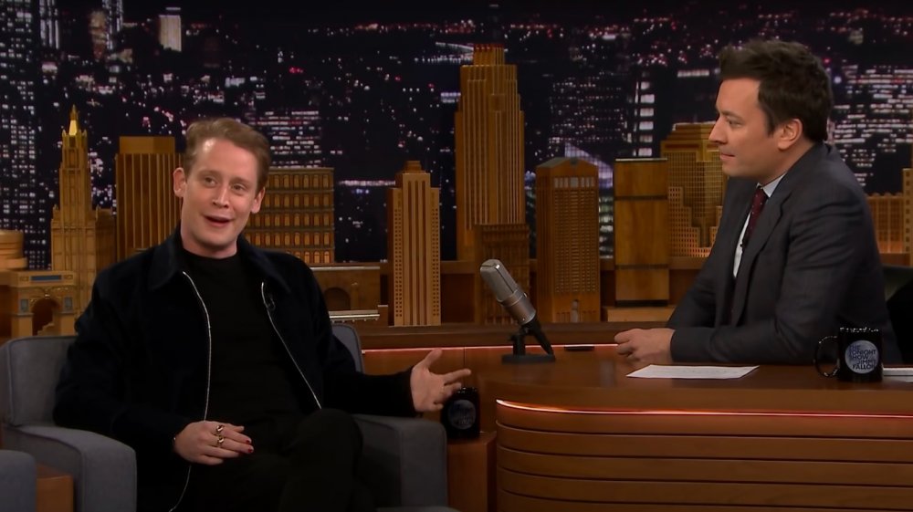 Macaulay Culkin speaking with Jimmy Fallon on The Tonight Show in 2018