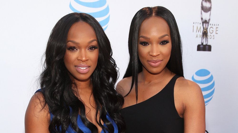 Khadijah Haqq and Malika Haqq smiling at camera together