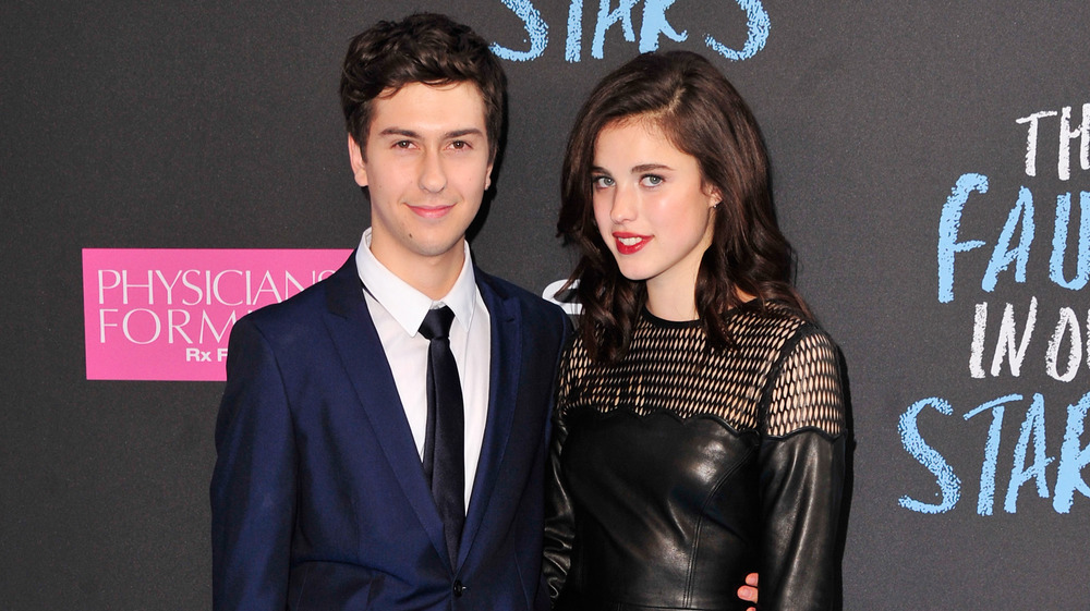 Margaret Qualley and Nat Wolff smiling together on the red carpet