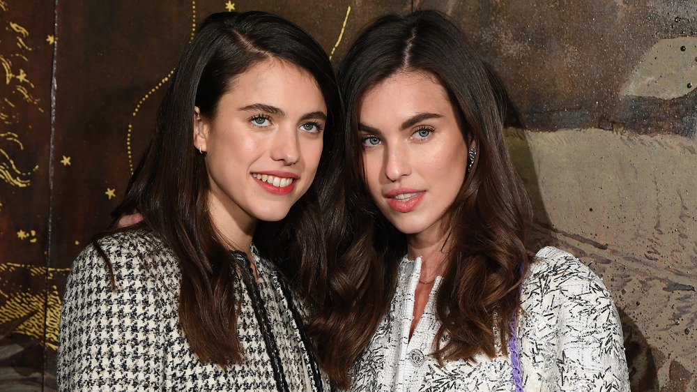 Margaret Qualley and her sister Rainey Qualley smiling together 